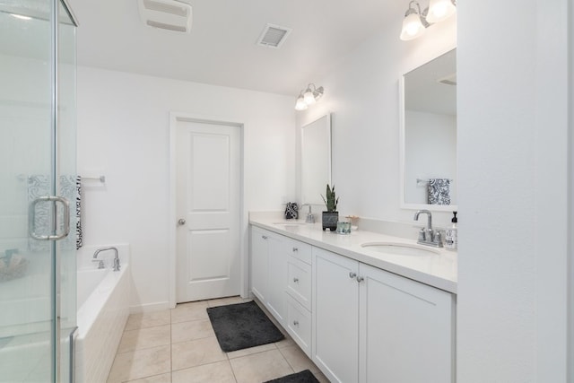 36961 Buccella Ln, Beaumont, CA 92223 - bathroom with double vanity, tile patterned flooring, a bath, and a shower stall