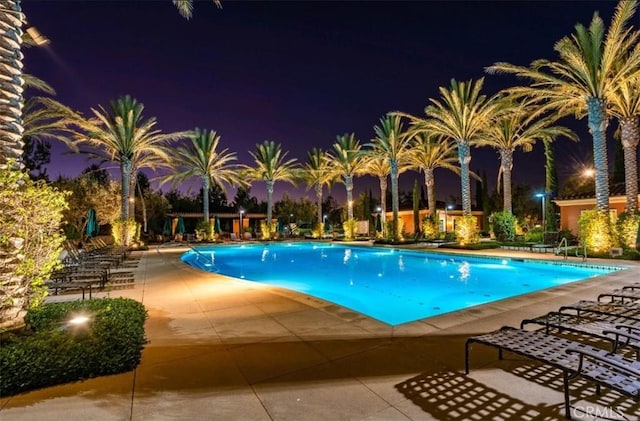 64 Full Moon, Irvine, CA 92618 - pool at night with a patio area and a community pool
