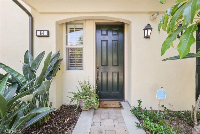 64 Full Moon, Irvine, CA 92618 - entrance to property featuring stucco siding
