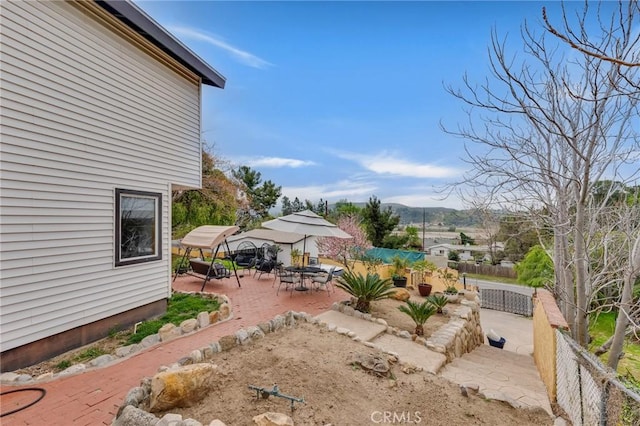 9707 Foothill Blvd, Sylmar, CA 91342 - fenced yard with a patio and a mountain view