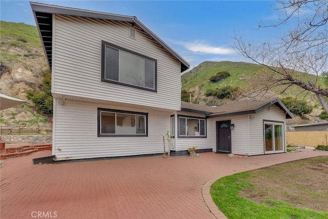 9707 Foothill Blvd, Sylmar, CA 91342 - back of property with a deck with mountain view