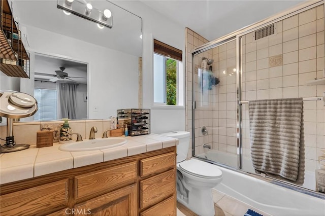 9707 Foothill Blvd, Sylmar, CA 91342 - bathroom featuring vanity, bath / shower combo with glass door, a ceiling fan, and tile patterned flooring
