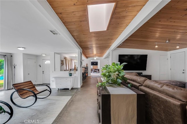 9707 Foothill Blvd, Sylmar, CA 91342 - living area featuring finished concrete flooring, wood ceiling, and a skylight