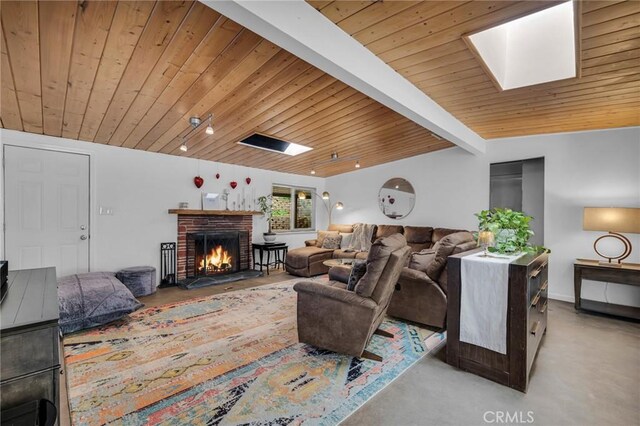9707 Foothill Blvd, Sylmar, CA 91342 - living room featuring wood ceiling, a skylight, and a fireplace