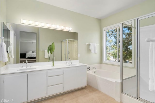 10 Via Berrendo, Rancho Santa Margarita, CA 92688 - bathroom with a shower stall, ensuite bathroom, a bath, double vanity, and tile patterned flooring