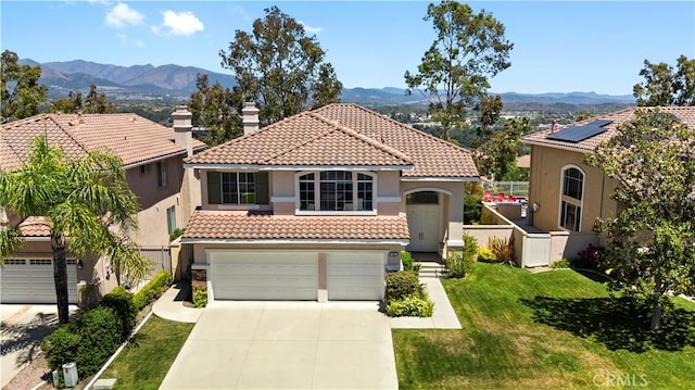 10 Via Berrendo, Rancho Santa Margarita, CA 92688 - mediterranean / spanish-style home with a tiled roof, a mountain view, stucco siding, and driveway