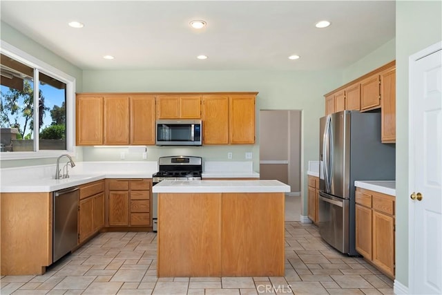 10 Via Berrendo, Rancho Santa Margarita, CA 92688 - kitchen featuring appliances with stainless steel finishes, a center island, light countertops, recessed lighting, and light tile patterned floors