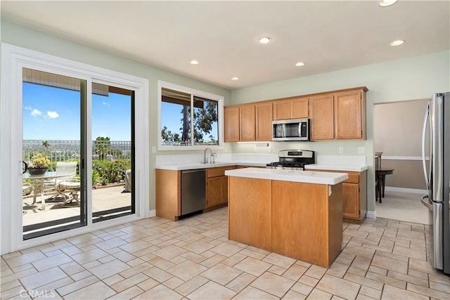 10 Via Berrendo, Rancho Santa Margarita, CA 92688 - kitchen featuring stainless steel appliances, light countertops, a center island, and recessed lighting
