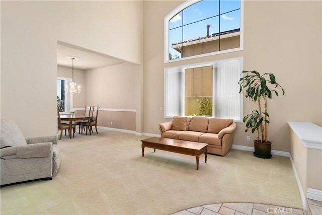 10 Via Berrendo, Rancho Santa Margarita, CA 92688 - carpeted living area featuring a towering ceiling and a chandelier