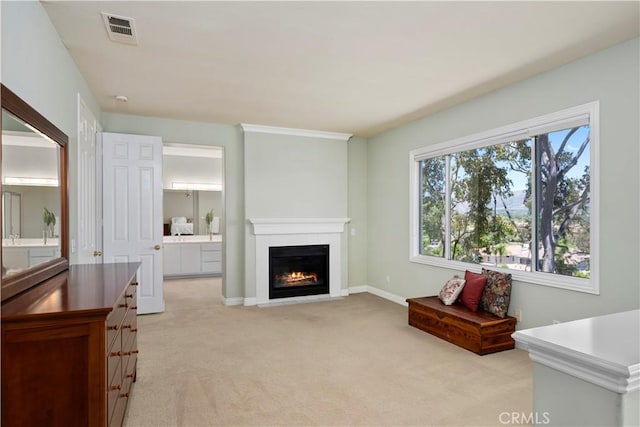 10 Via Berrendo, Rancho Santa Margarita, CA 92688 - living area with light carpet and a warm lit fireplace