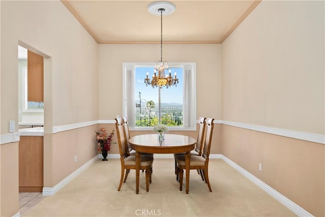 10 Via Berrendo, Rancho Santa Margarita, CA 92688 - dining area featuring a chandelier, light colored carpet, and crown molding