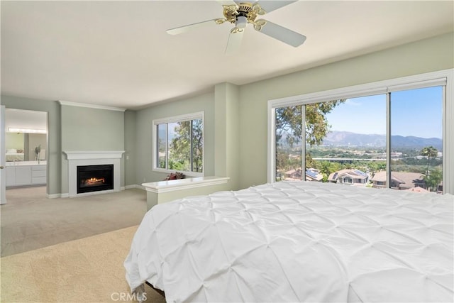 10 Via Berrendo, Rancho Santa Margarita, CA 92688 - bedroom featuring carpet flooring, a mountain view, a lit fireplace, access to outside, and ceiling fan