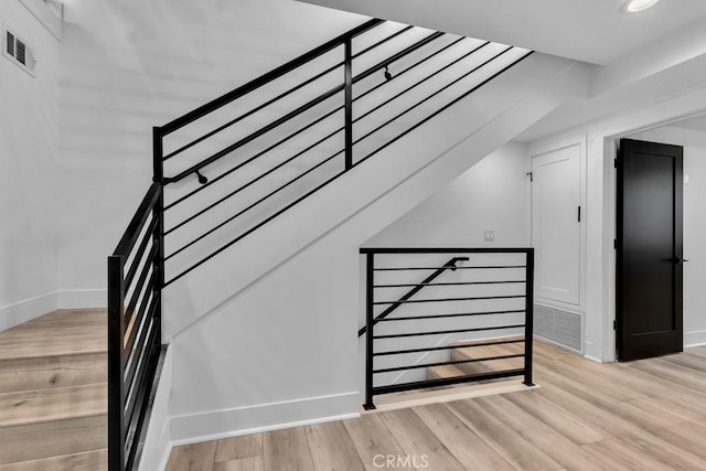 11304 Victory Blvd, North Hollywood, CA 91606 - stairs featuring wood finished floors and recessed lighting