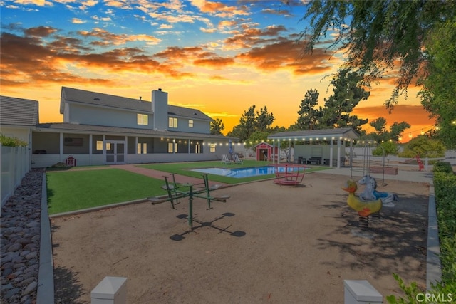 41559 Floyd Ct, Temecula, CA 92592 - view of community with a patio, a pool, a fenced backyard, and an outbuilding