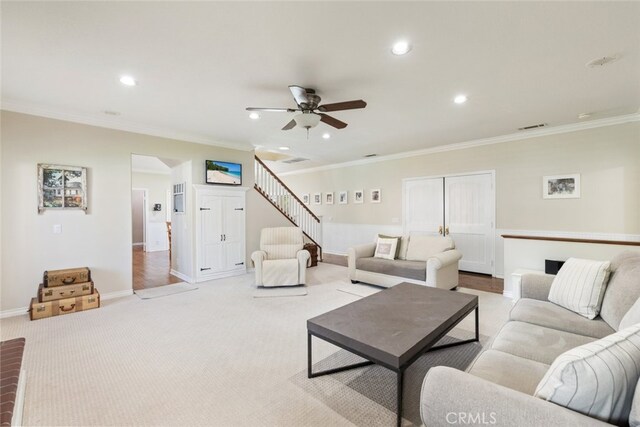 41559 Floyd Ct, Temecula, CA 92592 - living room featuring recessed lighting, a ceiling fan, light carpet, crown molding, and stairs
