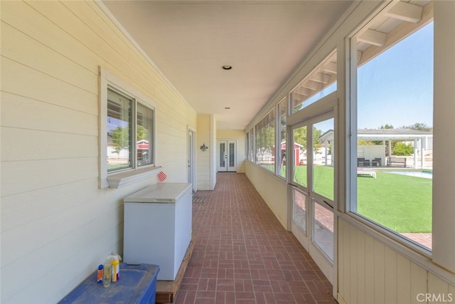 41559 Floyd Ct, Temecula, CA 92592 - unfurnished sunroom with french doors, brick patterned flooring, and wooden walls