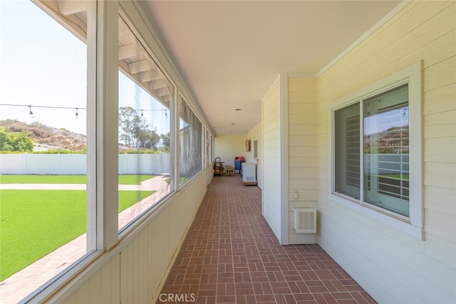 41559 Floyd Ct, Temecula, CA 92592 - corridor with brick patterned flooring and wooden walls