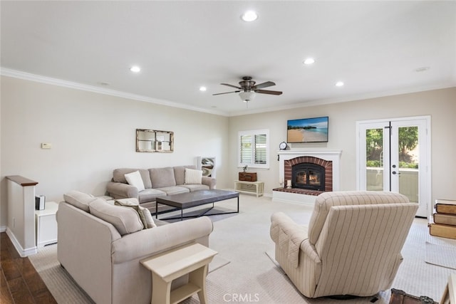 41559 Floyd Ct, Temecula, CA 92592 - living area with recessed lighting, ornamental molding, ceiling fan, a brick fireplace, and wood finished floors