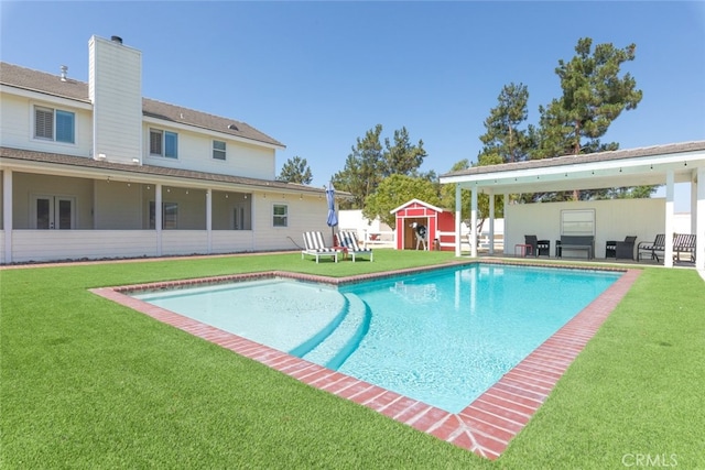 41559 Floyd Ct, Temecula, CA 92592 - view of swimming pool with a storage unit, a lawn, and a patio area