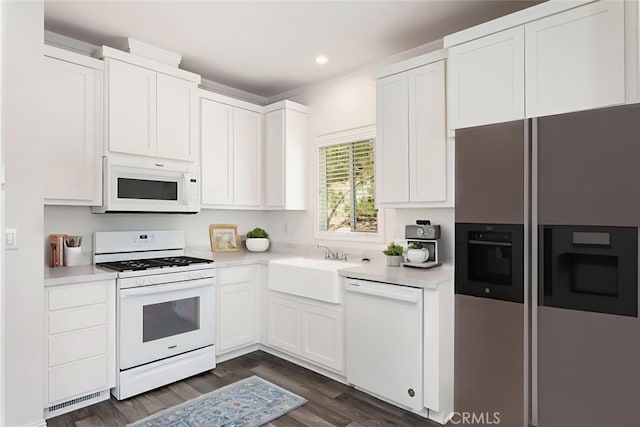 41559 Floyd Ct, Temecula, CA 92592 - kitchen with white appliances, dark wood-style floors, light countertops, white cabinetry, and recessed lighting
