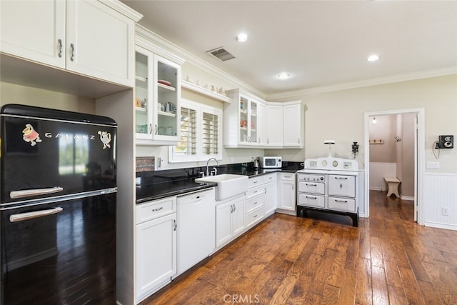 41559 Floyd Ct, Temecula, CA 92592 - kitchen featuring white appliances, ornamental molding, white cabinets, dark wood-style flooring, and dark countertops