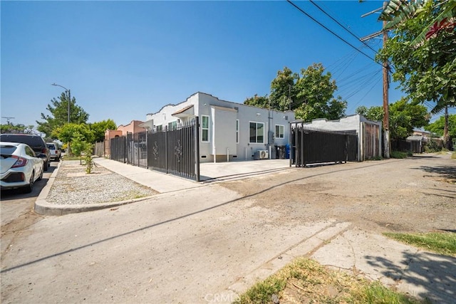 8217 Towne Ave, Los Angeles, CA 90003 - view of front of property featuring a gate and stucco siding