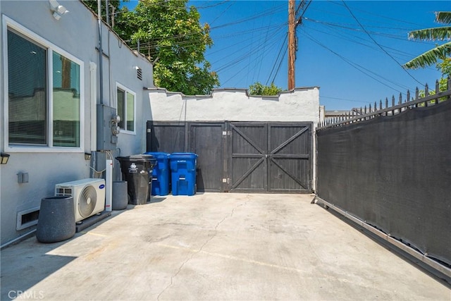 8217 Towne Ave, Los Angeles, CA 90003 - fenced backyard featuring a gate and a patio area