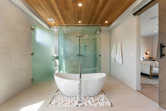 5530 Candlelight Dr, La Jolla, CA 92037 - full bath featuring wooden ceiling, ensuite bathroom, a freestanding tub, a shower stall, and tile patterned flooring