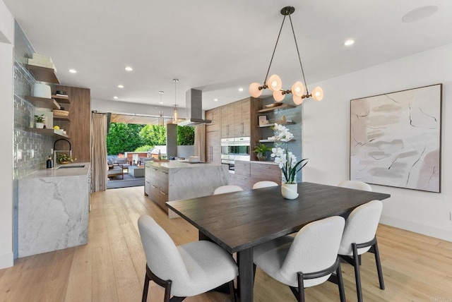 5530 Candlelight Dr, La Jolla, CA 92037 - dining area with light wood-type flooring and recessed lighting