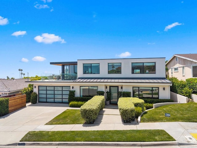 5530 Candlelight Dr, La Jolla, CA 92037 - contemporary house featuring stucco siding, a standing seam roof, driveway, and a metal roof