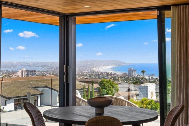 5530 Candlelight Dr, La Jolla, CA 92037 - dining space featuring a water view, a view of city, and a wall of windows