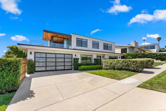 5530 Candlelight Dr, La Jolla, CA 92037 - contemporary house with a balcony, stucco siding, concrete driveway, a front yard, and an attached garage