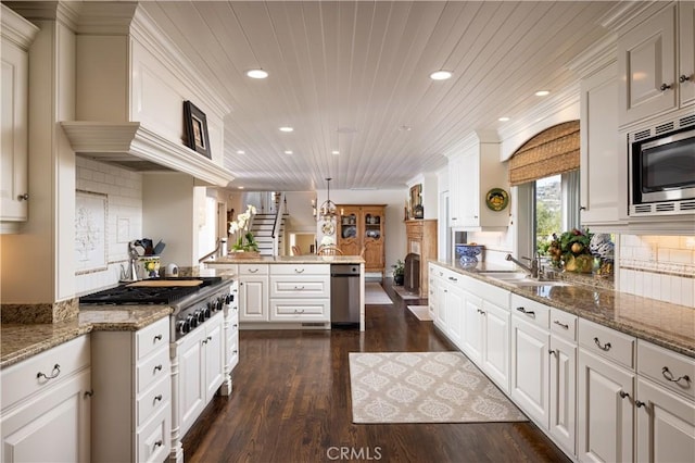 126 Monarch Bay, Dana Point, CA 92629 - kitchen with stainless steel appliances, recessed lighting, dark wood-style flooring, tasteful backsplash, and white cabinets