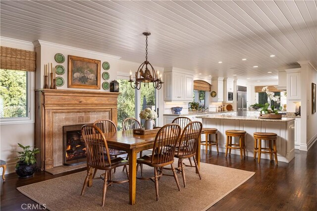 126 Monarch Bay, Dana Point, CA 92629 - dining space featuring plenty of natural light, a chandelier, recessed lighting, a tiled fireplace, and crown molding