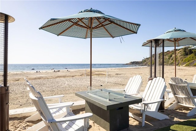 126 Monarch Bay, Dana Point, CA 92629 - view of patio with an outdoor fire pit and view of water and beach