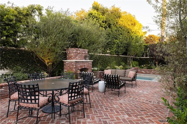 126 Monarch Bay, Dana Point, CA 92629 - view of patio / terrace with an outdoor living space with a fireplace and outdoor dining space