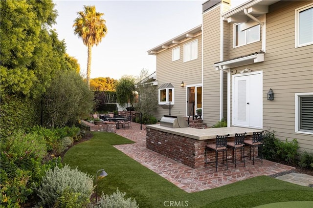 126 Monarch Bay, Dana Point, CA 92629 - view of patio featuring a bar and exterior kitchen