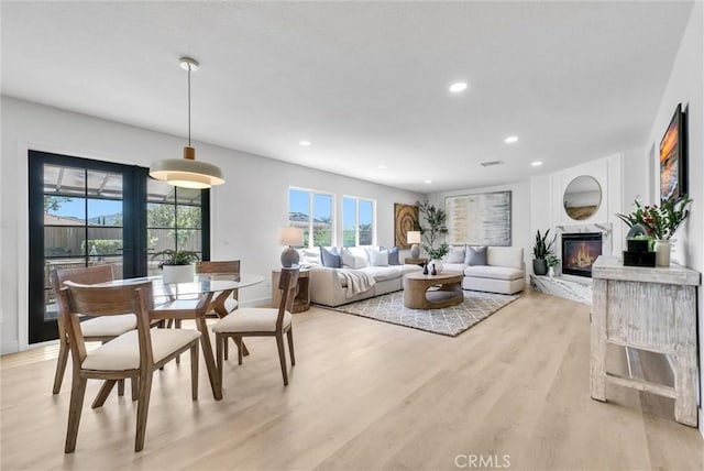 46079 Galaxy Ct, Temecula, CA 92592 - dining room with recessed lighting, a high end fireplace, and light wood finished floors