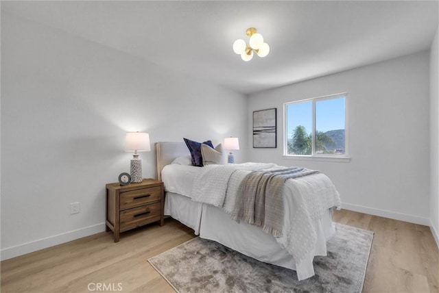 46079 Galaxy Ct, Temecula, CA 92592 - bedroom with baseboards and light wood-style flooring