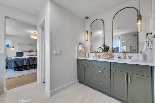 46079 Galaxy Ct, Temecula, CA 92592 - ensuite bathroom with double vanity and a textured wall