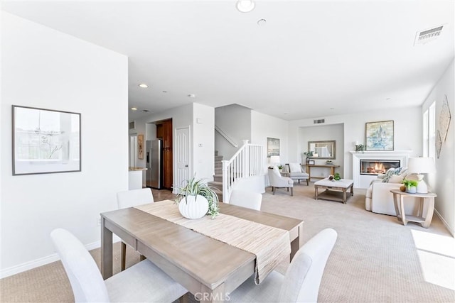 61 Via Almeria, San Clemente, CA 92673 - dining room with light colored carpet, stairway, recessed lighting, and a glass covered fireplace