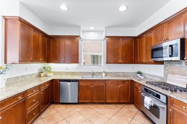 61 Via Almeria, San Clemente, CA 92673 - kitchen featuring stainless steel appliances, light tile patterned floors, light stone counters, recessed lighting, and backsplash