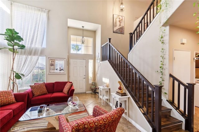 25880 Jumano Dr, Moreno Valley, CA 92551 - tiled living room with a towering ceiling and stairway