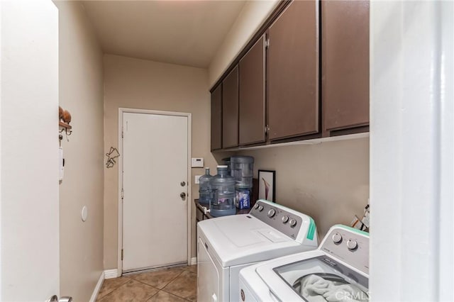 25880 Jumano Dr, Moreno Valley, CA 92551 - laundry area featuring cabinet space, independent washer and dryer, and light tile patterned floors