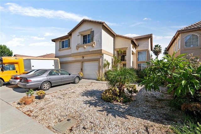 25880 Jumano Dr, Moreno Valley, CA 92551 - view of front facade featuring driveway, a garage, and stucco siding