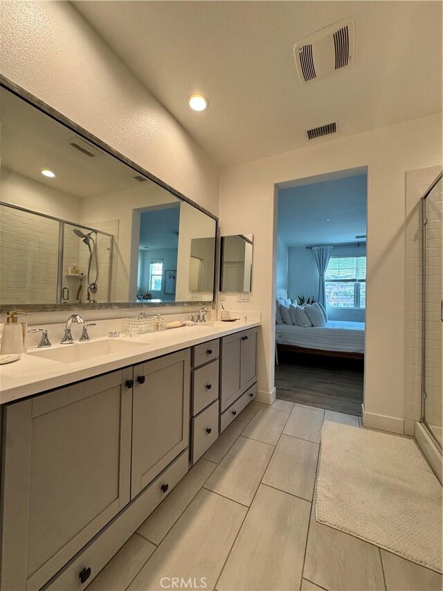 15946 Ellington, Chino Hills, CA 91709 - ensuite bathroom featuring a stall shower, double vanity, tile patterned flooring, and recessed lighting