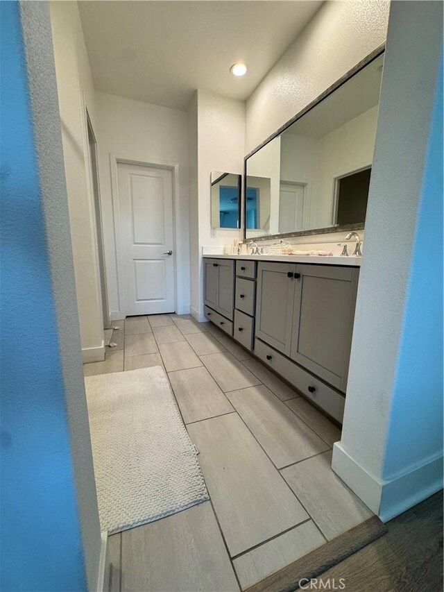 15946 Ellington, Chino Hills, CA 91709 - full bathroom featuring double vanity and baseboards