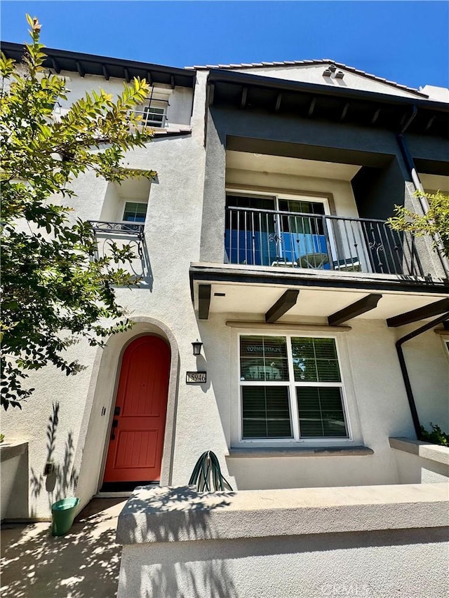15946 Ellington, Chino Hills, CA 91709 - view of front facade featuring a balcony and stucco siding