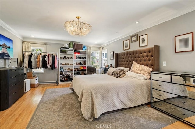 2211 N Moody Ave, Fullerton, CA 92831 - bedroom featuring crown molding, wood finished floors, a chandelier, and recessed lighting