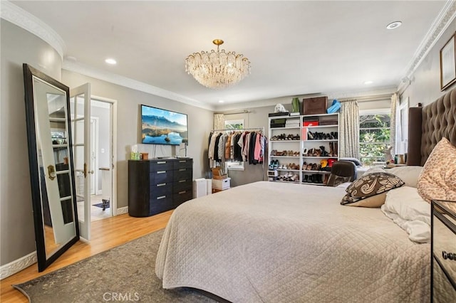 2211 N Moody Ave, Fullerton, CA 92831 - bedroom featuring crown molding, light wood-type flooring, a chandelier, and recessed lighting